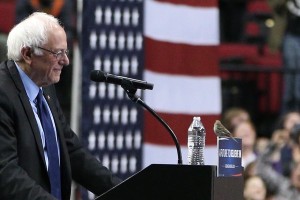 A bird lands on Bernie Sanders' podium (PBS)