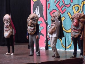 Puppet-headed actors on stage: Bread & Puppet Theater