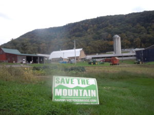 Lawn sign from the Save the Mountain campaign in Hadley, MA, in front of Mount Holyoke (a state park next to the mountain we saved)