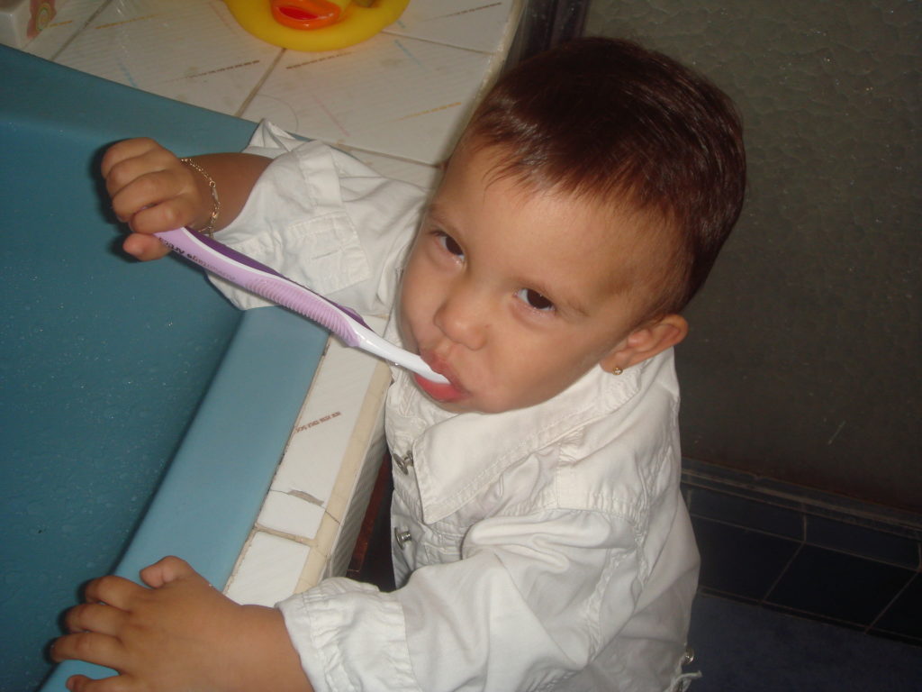 Child brushing teeth (FreeImages.com)