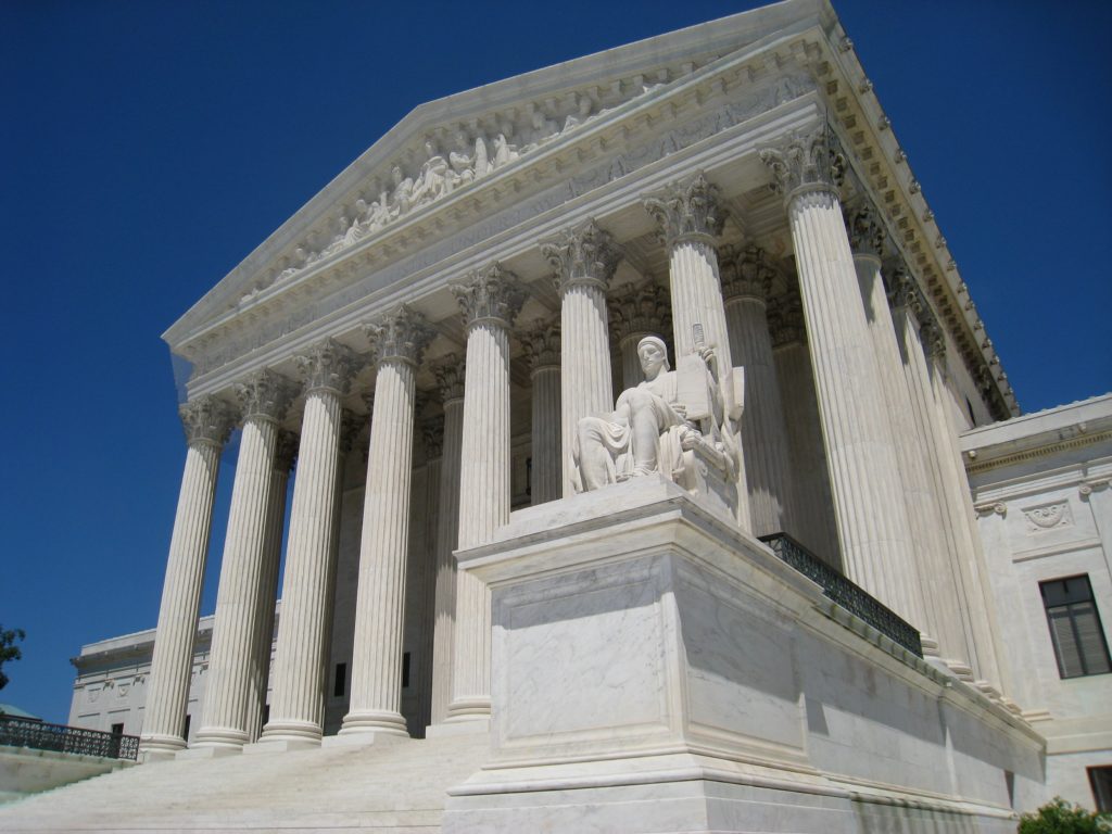 US Supreme Court building, Washington, DC. Pubic domain photo found at https://ang.wikipedia.org/wiki/Ymele:Oblique_facade_2,_US_Supreme_Court.jpg